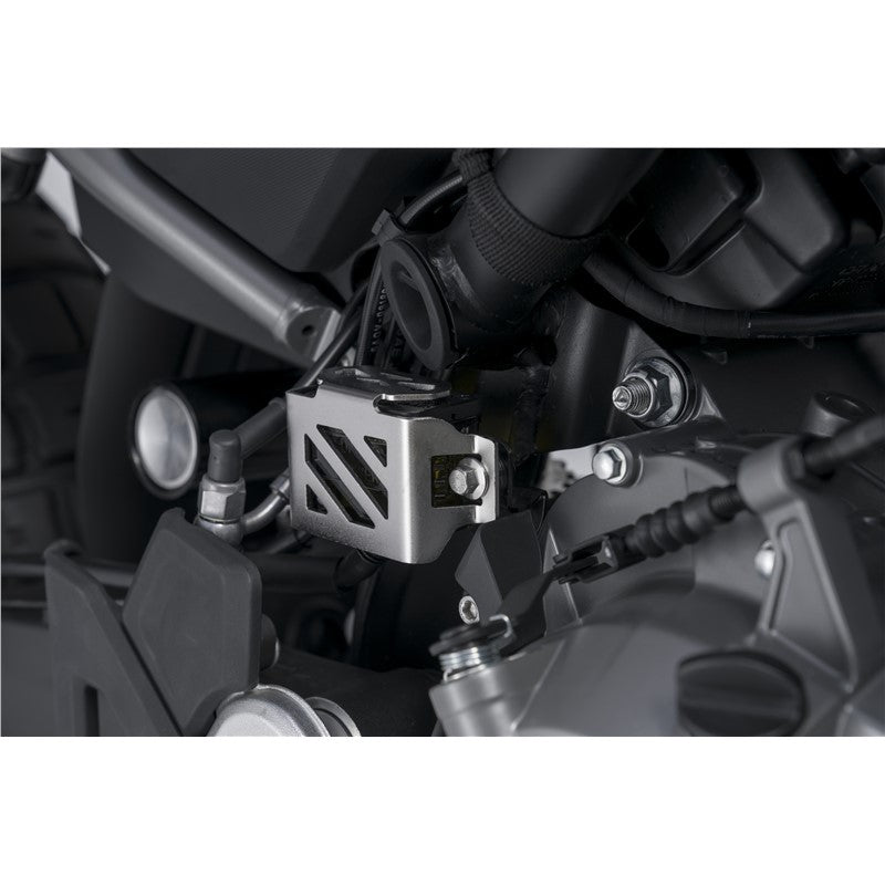 Close-up of a motorcycle engine with Rear Brake Fluid Reservoir Guard