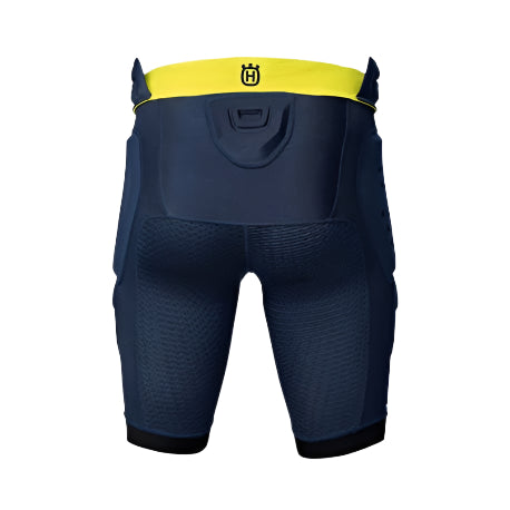 Navy protective shorts with yellow waistband on a light gray background
