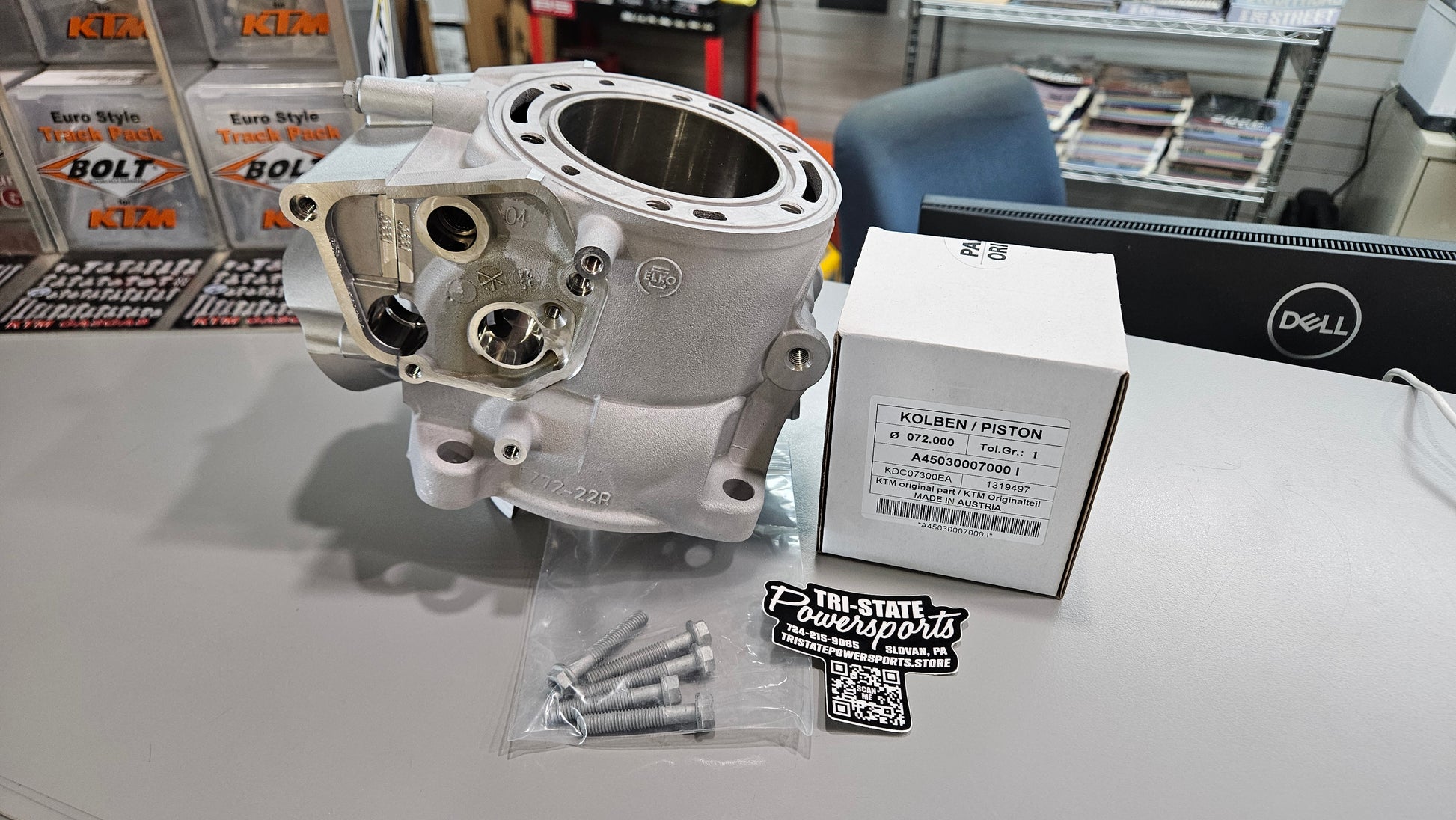 A45030438000 300 Cylinder Piston with a shop background