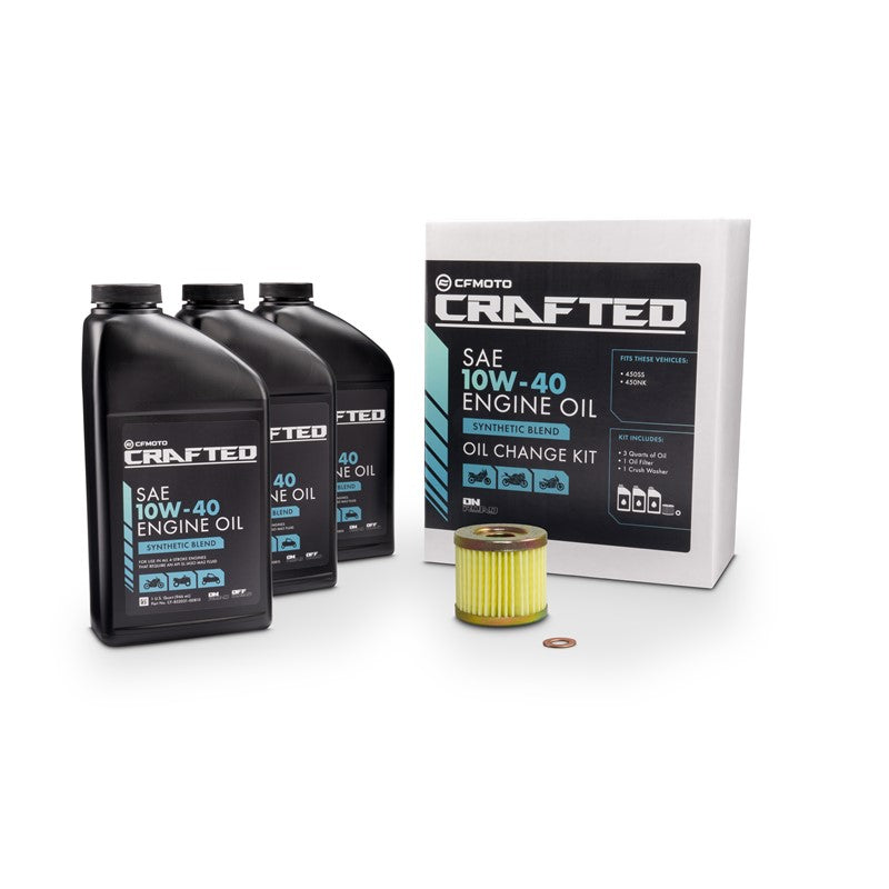 An oil change kit by CFMOTO CRAFTED, including three quarts of motor oil, an oil filter, and packaging.