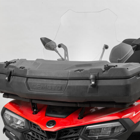 A large black cargo box with a clear windshield mounted on the front of a red CFMOTO vehicle.