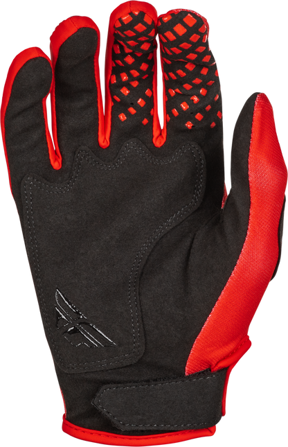 Black and red glove with textured palm on a white background