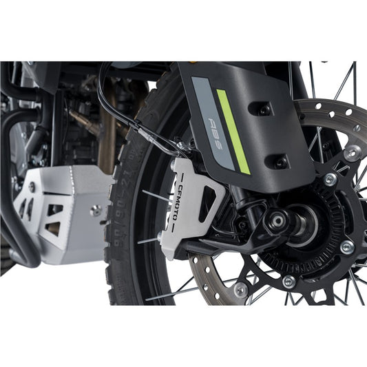 Close-up of a motorcycle wheel with Front Brake Caliper Guard â€“ Stainless Steel â€“ Ibex 450