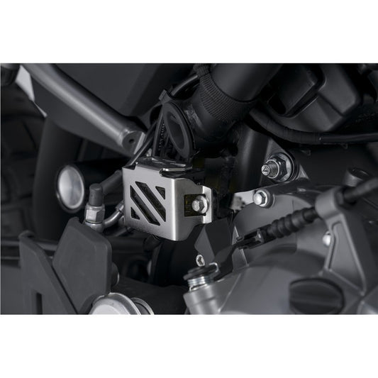 Close-up of a motorcycle engine with Rear Brake Fluid Reservoir Guard