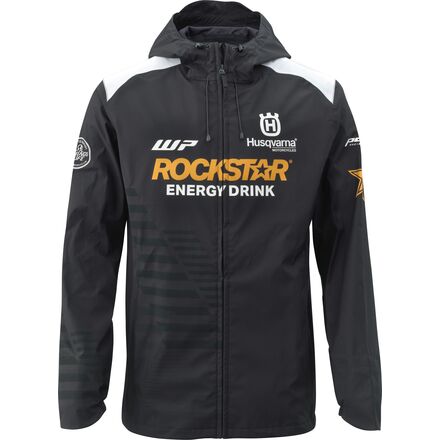 A black motorcycle jacket with Rockstar Energy Drink and Husqvarna branding, featuring a hood, zippered front, and extended sleeve cuff.