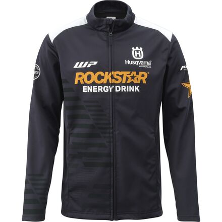 A black softshell jacket with Rockstar Energy Drink and Husqvarna branding, featuring a zipper front and elastic cuffs.