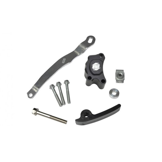 Mechanical parts including a metal bracket, bolts, and cylindrical components on a white background