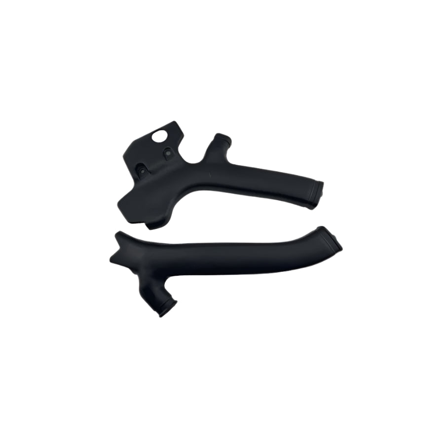 Two black plastic components on a white background