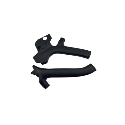 Two black plastic components on a white background