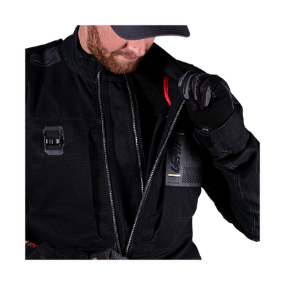 Person wearing a black jacket with brand logo on a white background